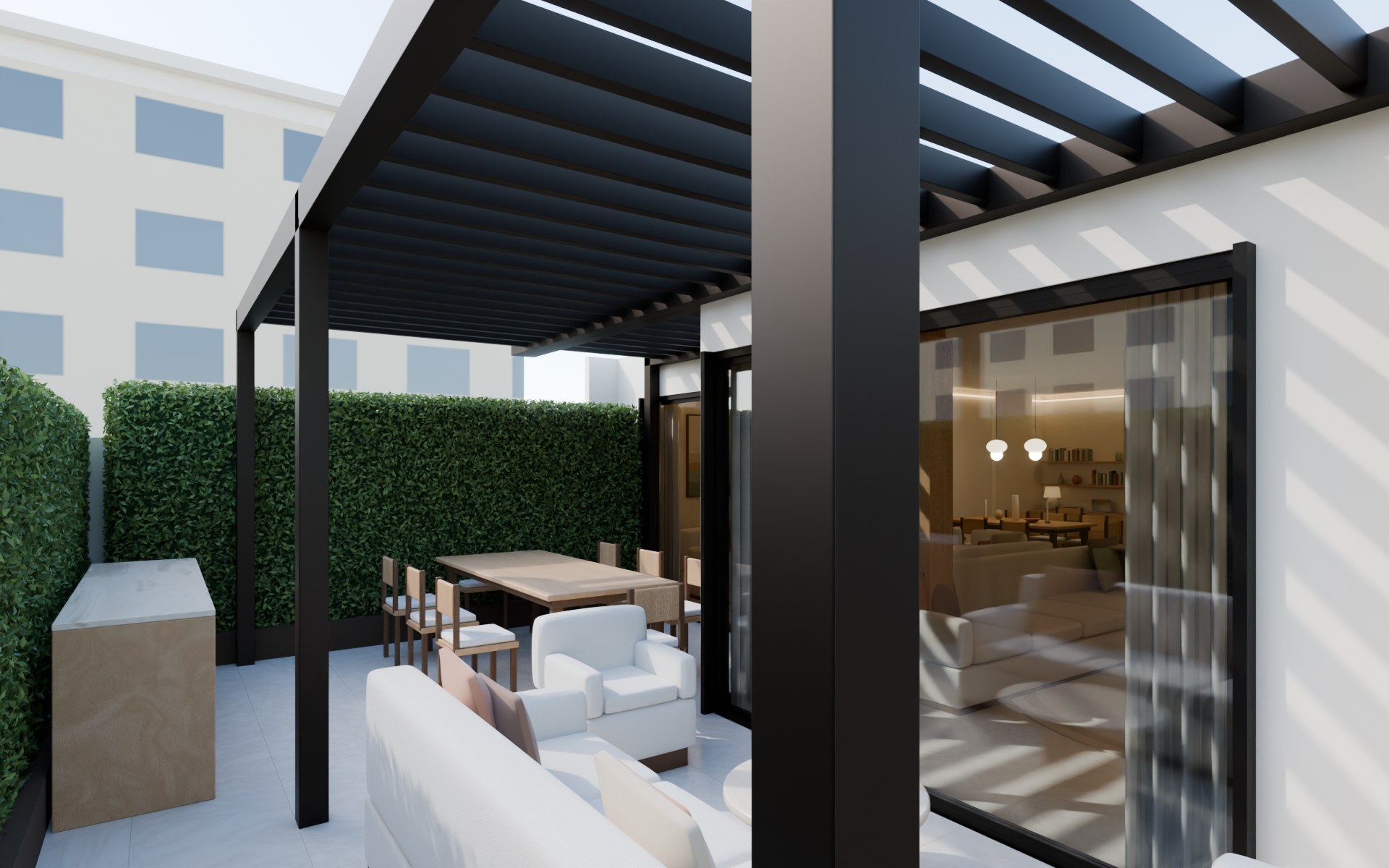 From the lawn toward the pergola terrace, the outdoor kitchen and the living room behind the glass