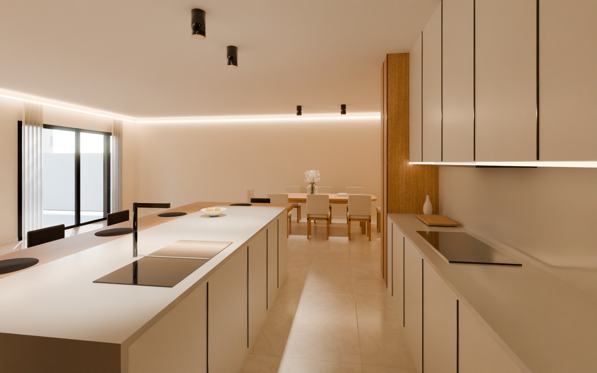 From the utility end of the kitchen toward the foyer: the island and sink on the left, the hob and wall cupboards on the right, the tall oak larder ahead